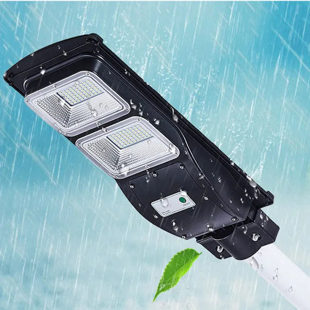60W integrated solar-powered LED street light unit with remote control for outdoor use.