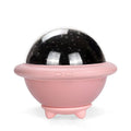 Pink UFO-shaped plastic LED night light projecting starry sky pattern on wall