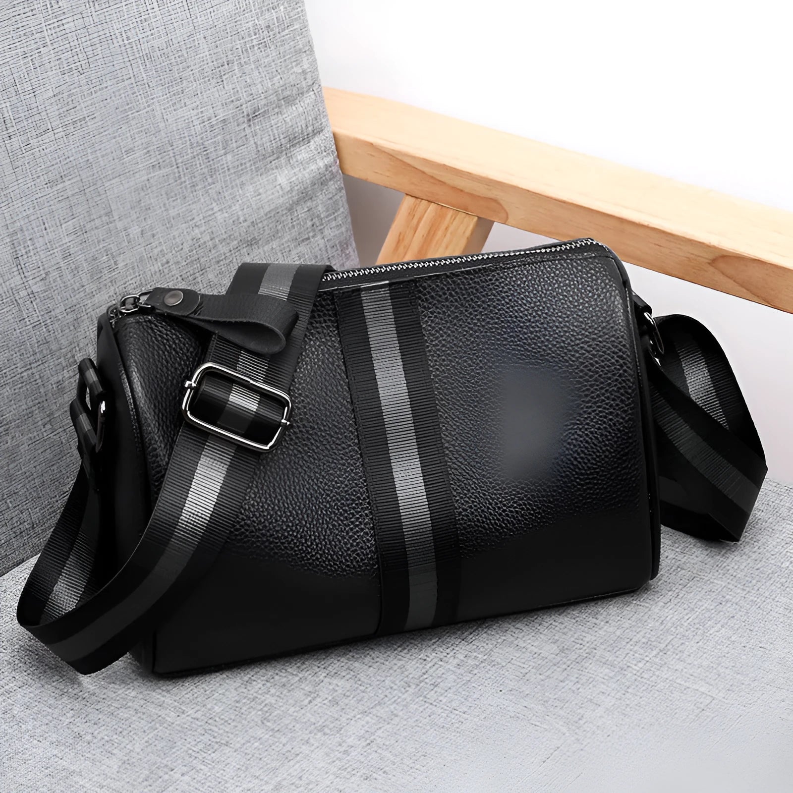 Black genuine leather crossbody bag showing 24x16x13cm dimensions with one-shoulder strap