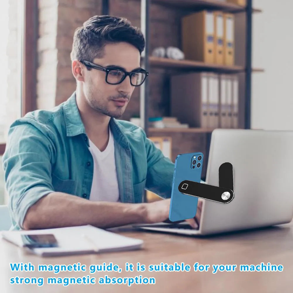 Black aluminium magnetic phone holder mounted on side of laptop screen.