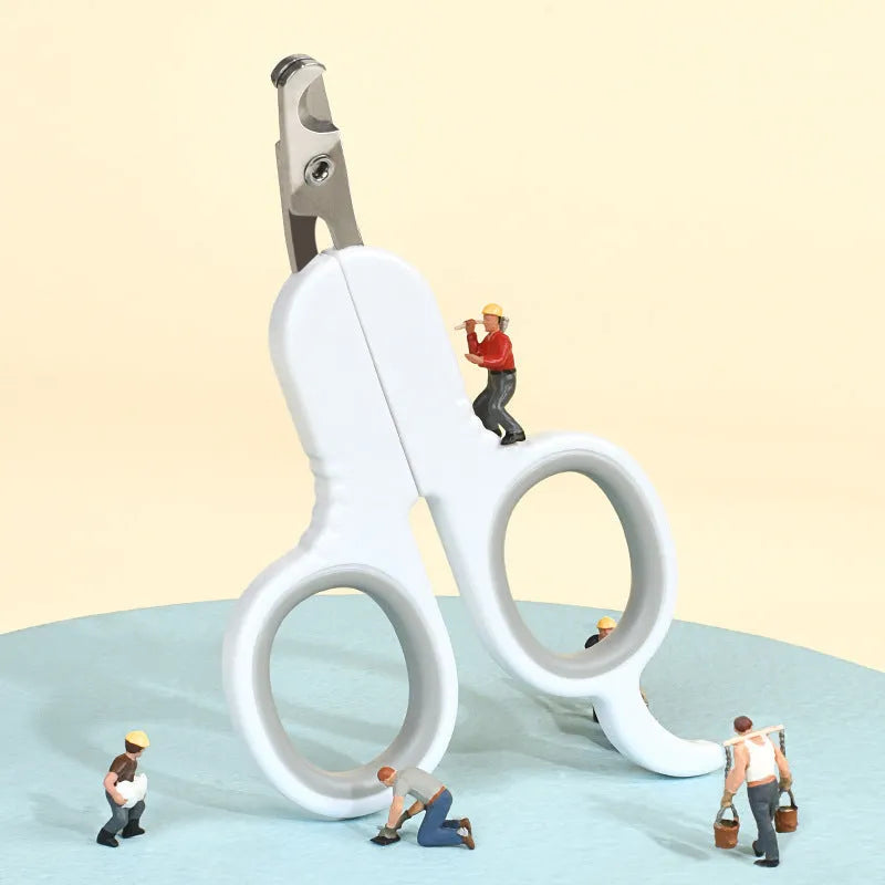 Grey and pink pet nail clippers with curved tips and a rubber-coated anti-slip handle on a white background.