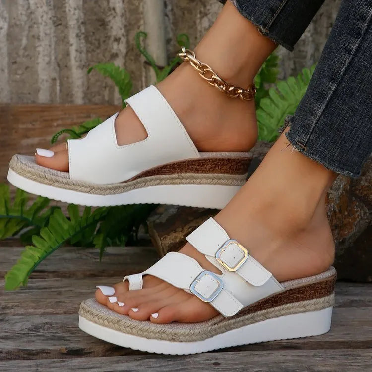 White patent leather wedge sandals with finger fit design and peep toe