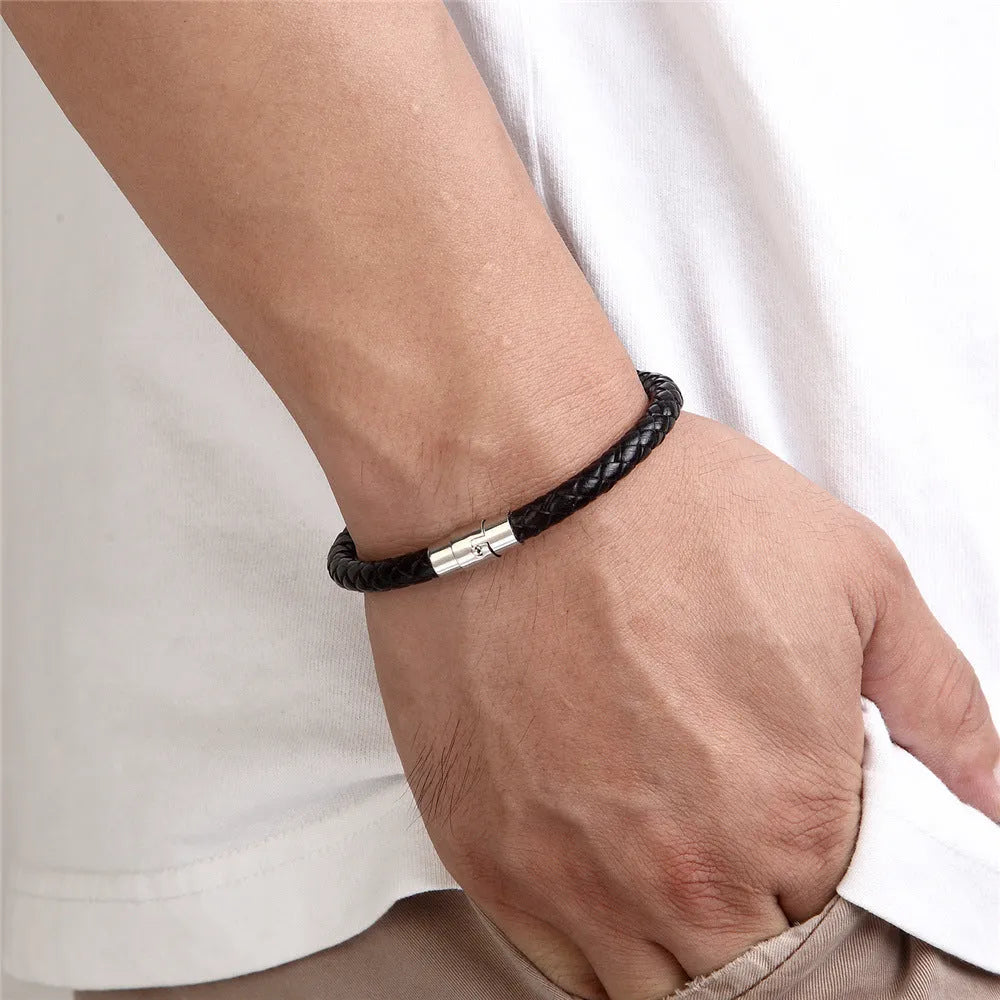 Geometric titanium steel wire bracelet with hidden magnetic clasp on a wrist, showing matte grey finish.
