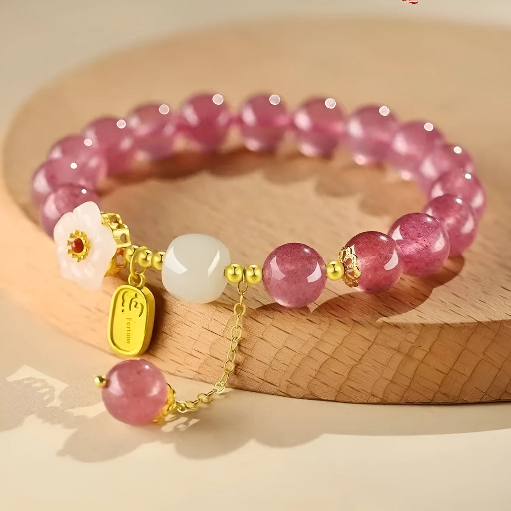 Handmade women's bracelet with Hetian jade and strawberry quartz crystals in peach blossom design