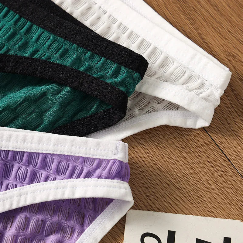 Men's low waist transparent visual lace underwear in multiple colours on a size chart