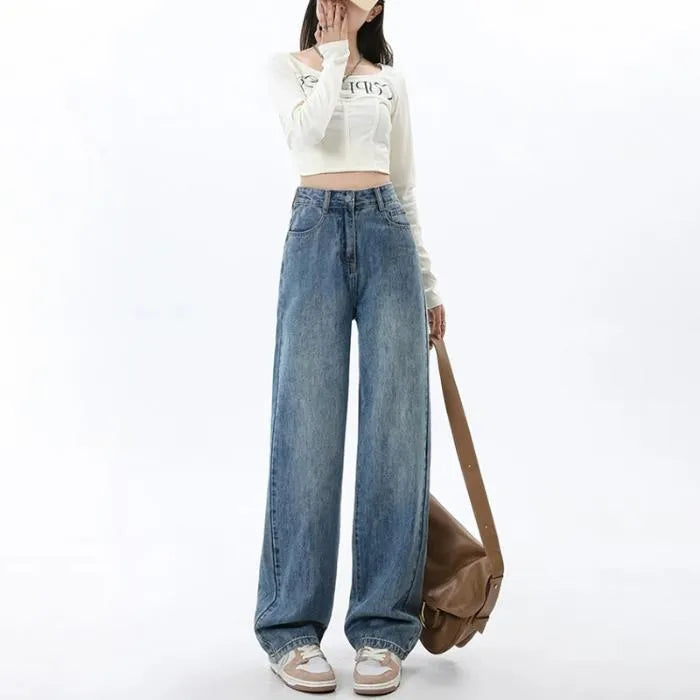 Woman wearing retro blue high-waisted wide-leg denim jeans with a straight-leg cut.