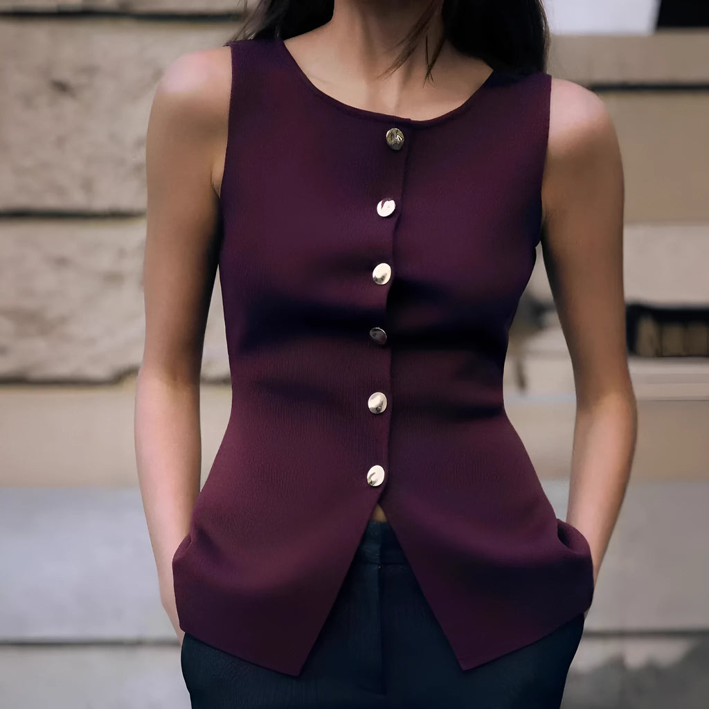 Women's dark red viscose knit sleeveless vest with gold buttons, shown on a model.