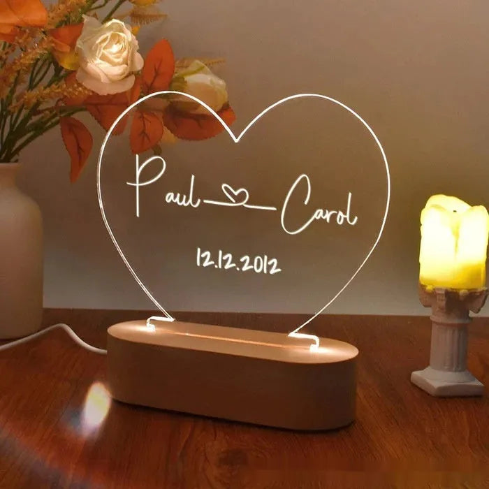 Custom acrylic LED night light with engraved names and date for Valentine's Day.
