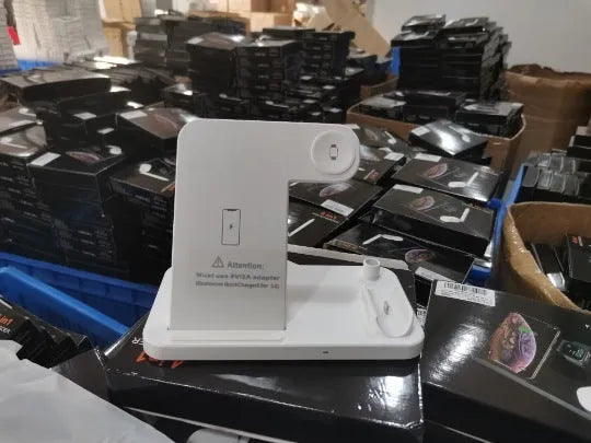 Foldable 4-in-1 wireless charging station in black, showing vertical phone stand and multiple charging pads for devices.