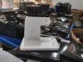 Foldable 4-in-1 wireless charging station in black, showing vertical phone stand and multiple charging pads for devices.