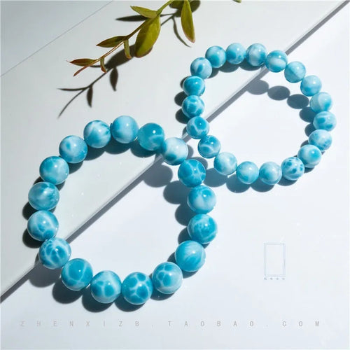 Blue handmade Bodhi bracelet with natural crystal, sea-pattern stone, and pearl in Maillard style.