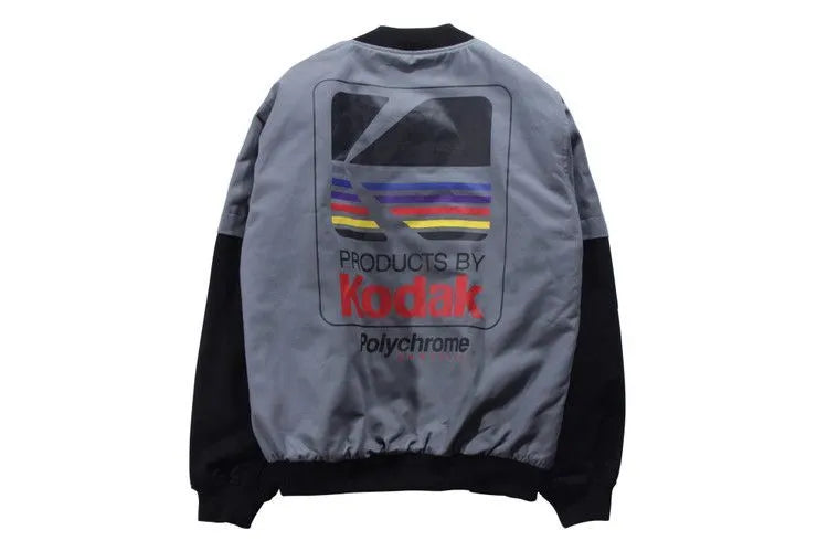 Hip hop style printed baseball jacket in Grey with round neck and side slit pockets on a model