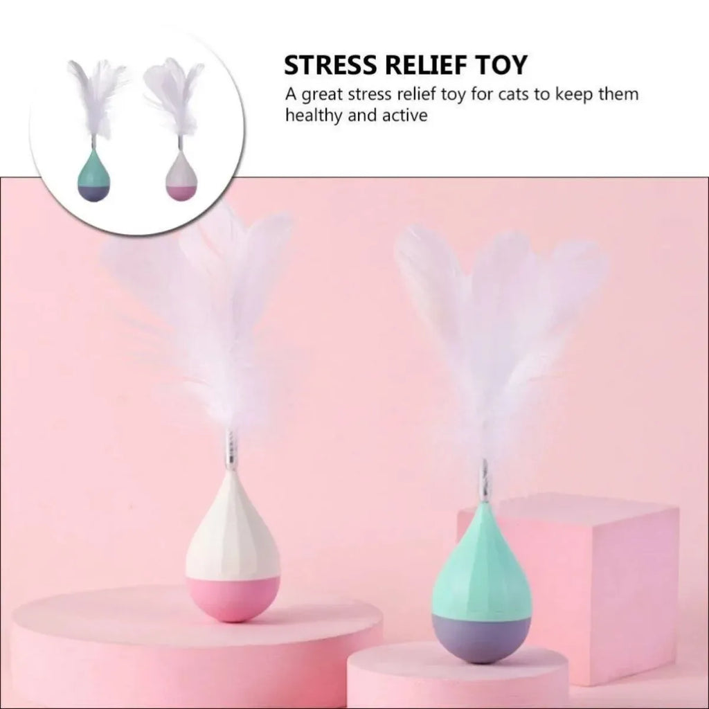 Feather tumbler cat toy with rolling ball and goose feather tease stick on a coloured background.