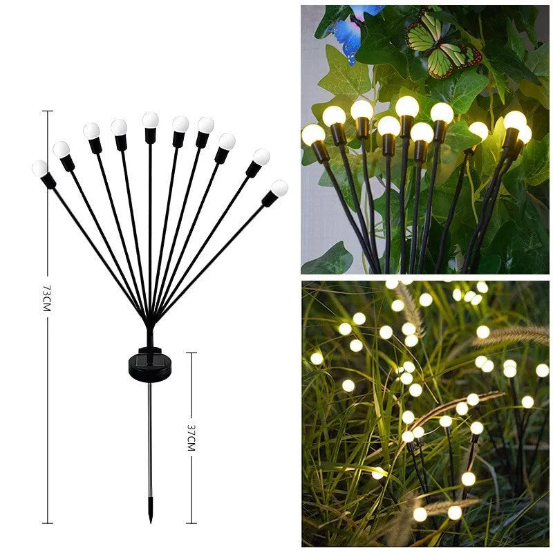 Solar-powered LED firefly garden spike light with multiple heads and a press-in ground plug on grass.
