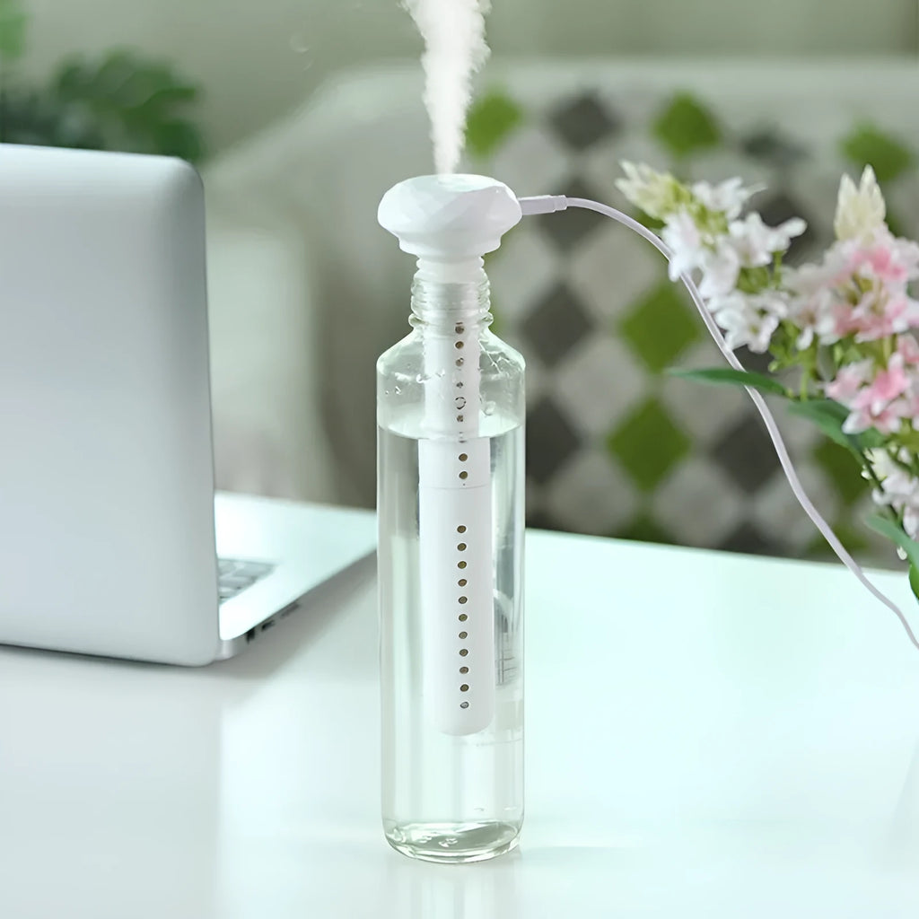 Donut mini humidifier USB car sprayer 54mm x 220mm in ABS and silicone, shown in Beige Elk, Pink Elk, or White