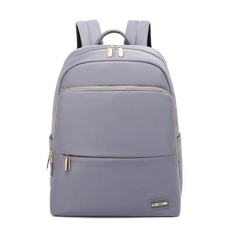Large black oxford cloth women's backpack with anti-theft compartments and padded straps.