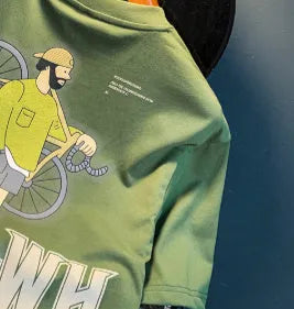 Green loose-fit men's short sleeve T-shirt with a printed design on the front.