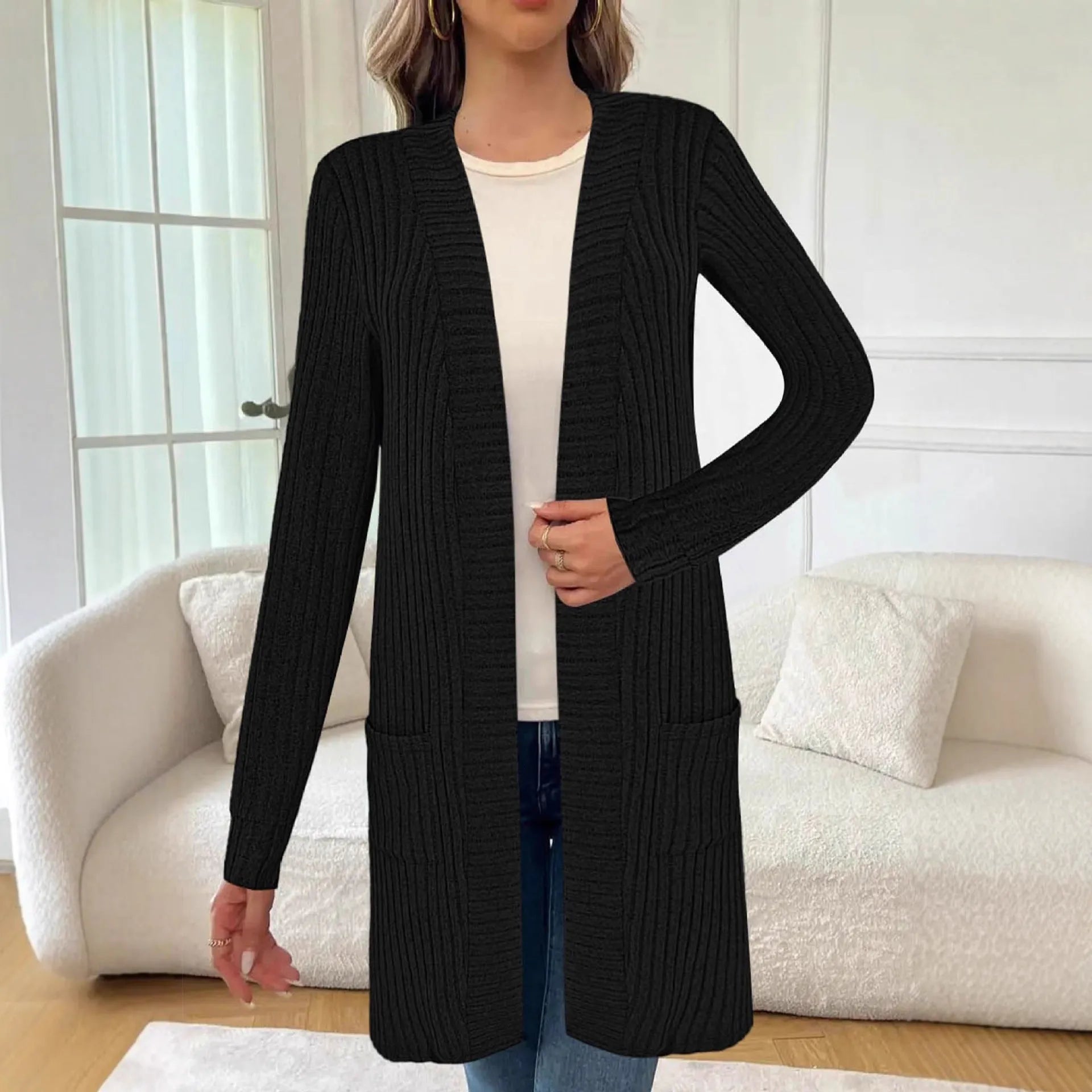 Long sleeve loose cardigan jacket in black, wine red, or grey with pockets, shown on a hanger.