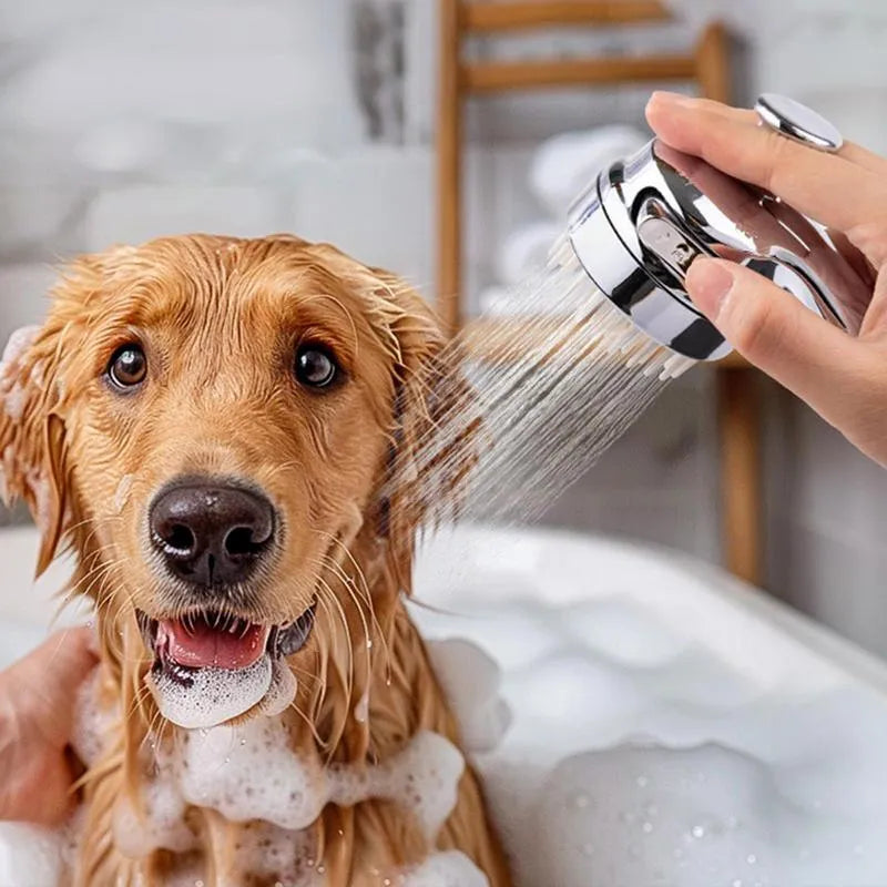 Silver coloured dog shower attachment with ergonomic grip and soft silicone comb teeth.