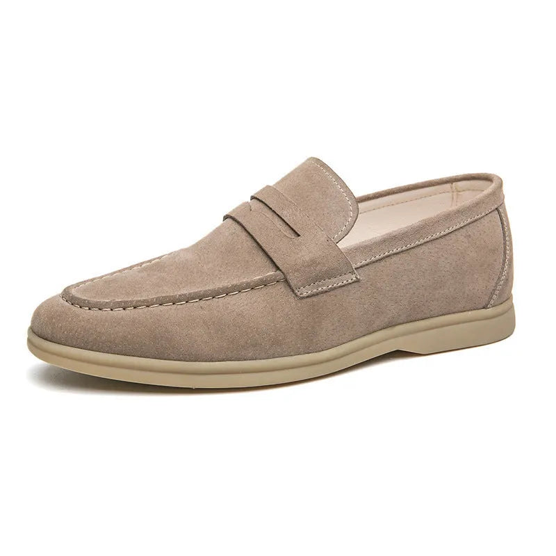 Men's black leather slip-on casual shoes with a round toe and rubber sole on a white background.