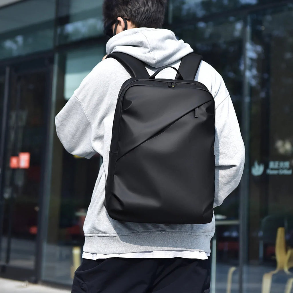 Large black waterproof backpack made from PU leather with sewing thread detailing