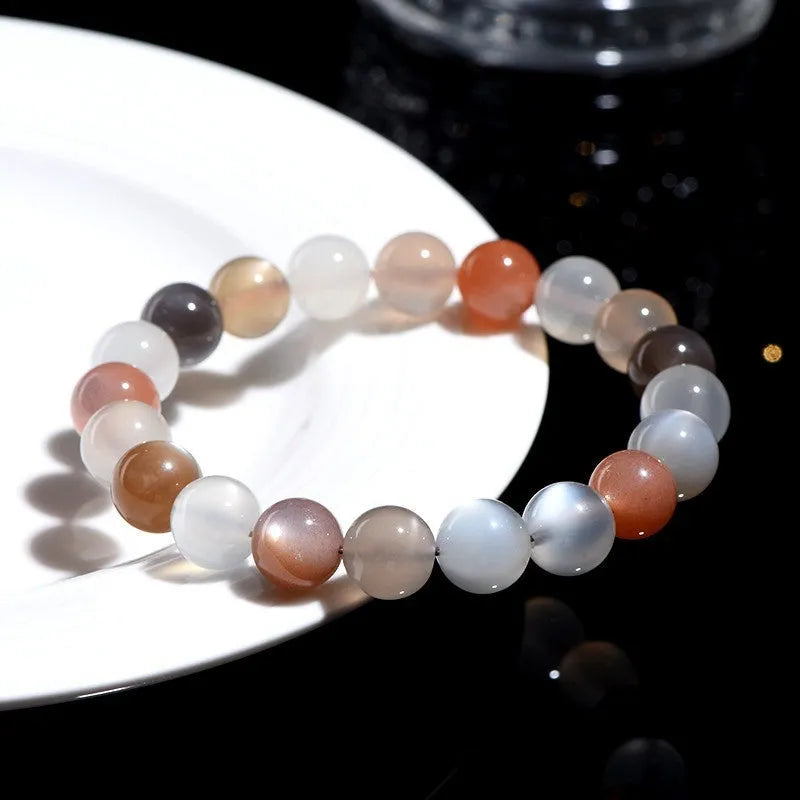 Natural colourful moonlight moonstone bracelet with 8mm beads on a white background.