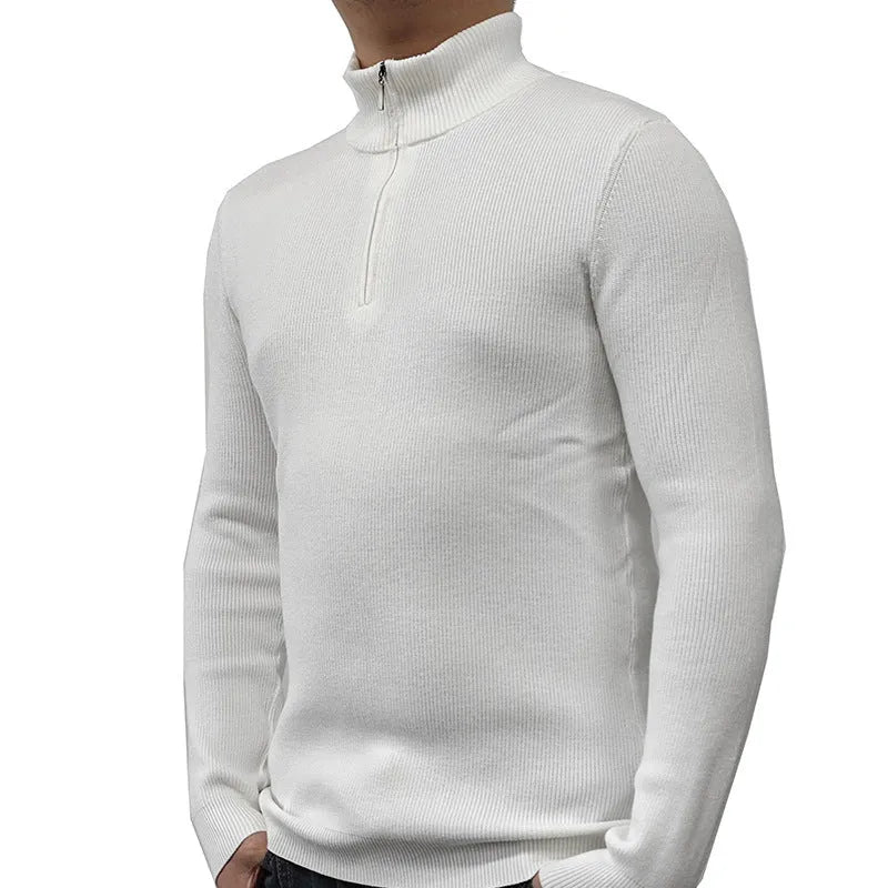 Man wearing a grey zip-front half-turtleneck sweater, a casual long-sleeve pullover.