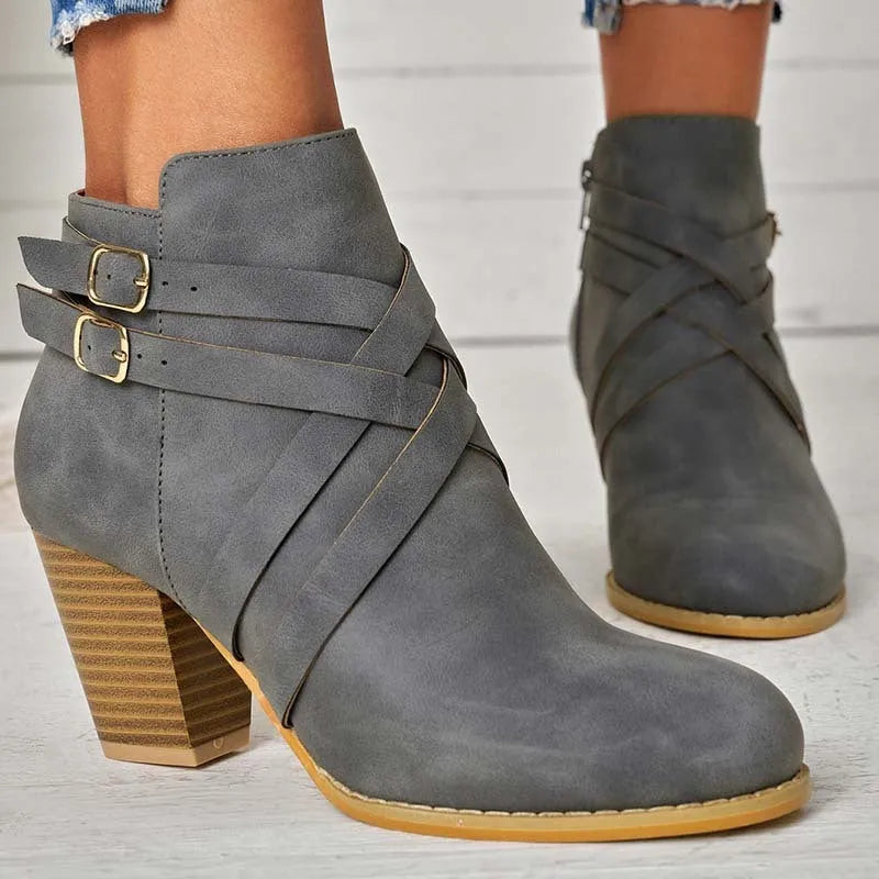 Plus size black short boot with side zipper, belt buckle, and a 7cm rubber heel