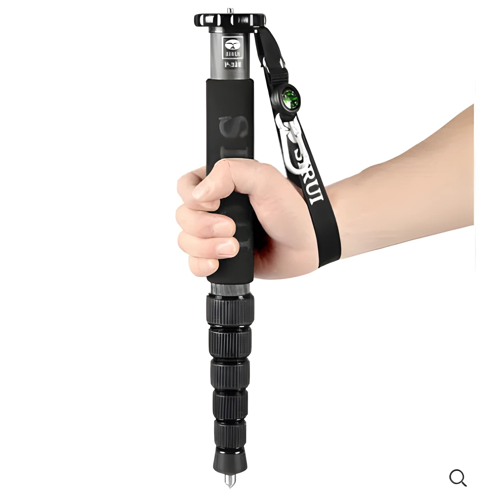 Black carbon fibre six-section SLR camera monopod extended to its maximum height.