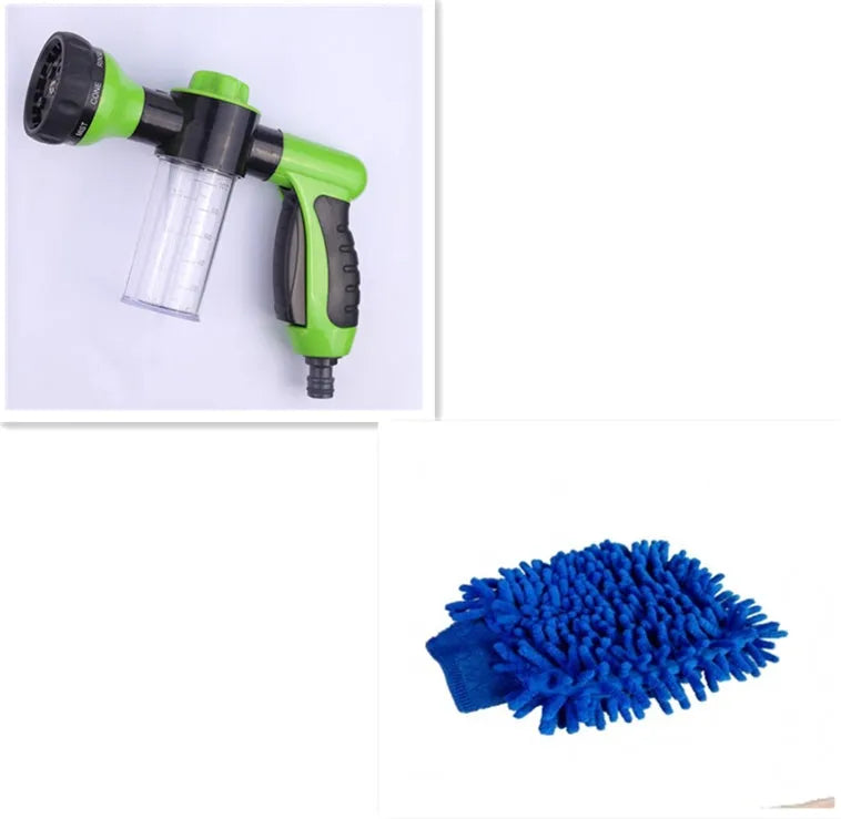 Green high-pressure foam spray gun for car washing with adjustable nozzle and attached water pipe.