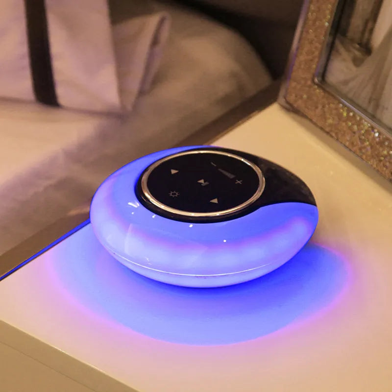 Blue Bluetooth desk lamp speaker with touch controls showing white, yellow and blue light options