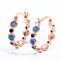 Round synthetic opal and cubic zirconia clip-on earrings in electroplated copper