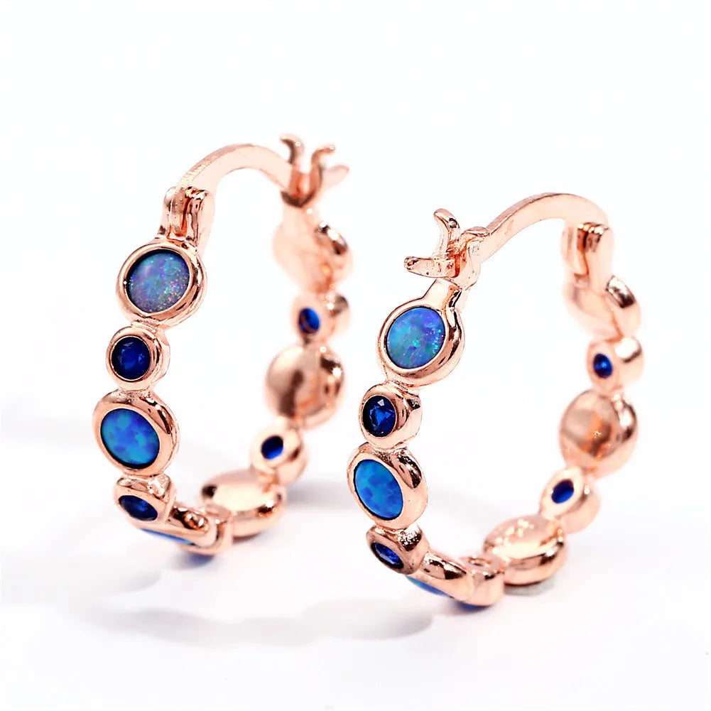 Round synthetic opal and cubic zirconia clip-on earrings in electroplated copper