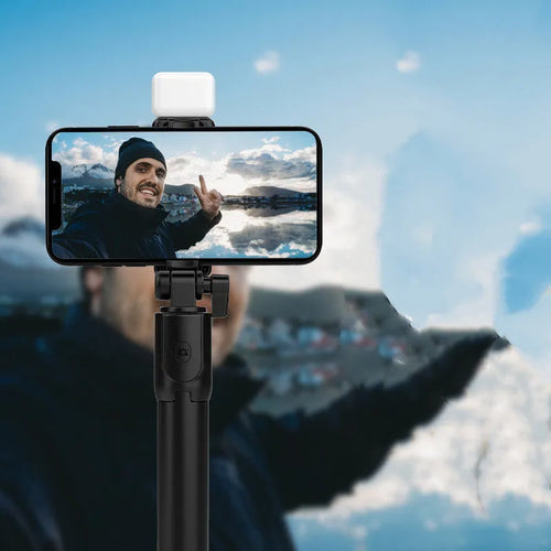 Aluminium alloy Bluetooth selfie stick with tripod base, fill light, and 360-degree rotating phone holder in black colour
