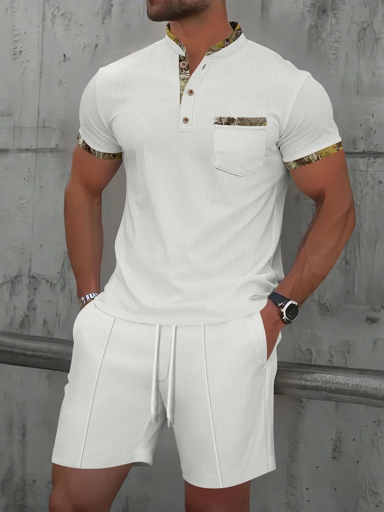 Man wearing a grey waffle knit zip-up polo collar top and matching shorts from a two-piece summer suit.