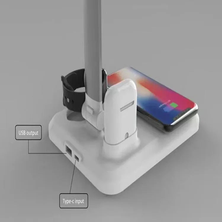 Black and white 4-in-1 LED desk lamp with wireless charging pad, Bluetooth speaker, and digital clock display.