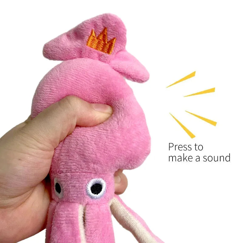 Pink squid-shaped corduroy dog chew toy with a squeaker.
