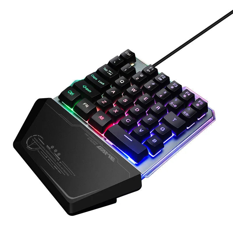Black G40 Flow one-handed gaming keyboard with RGB backlit keys on a dark surface.