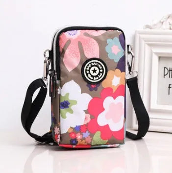 Vertical mobile phone bag in black with Oxford Spinning texture and zipper closure