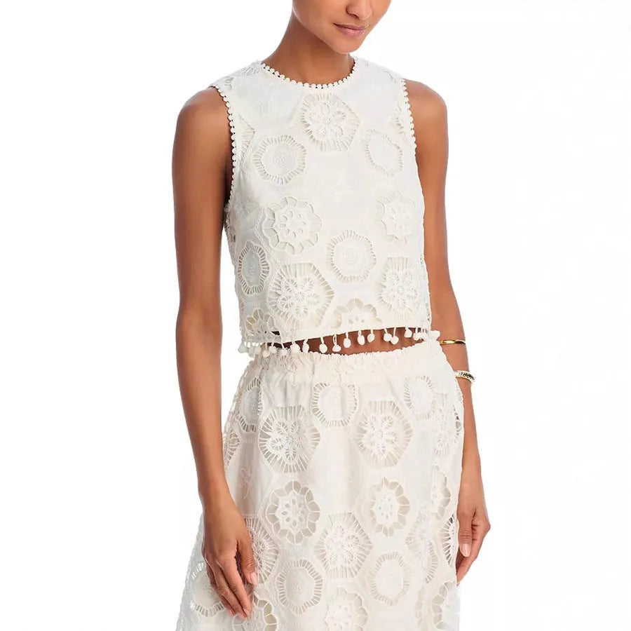Literary Trends white women's suit with embroidered long skirt and sleeveless top on a hanger
