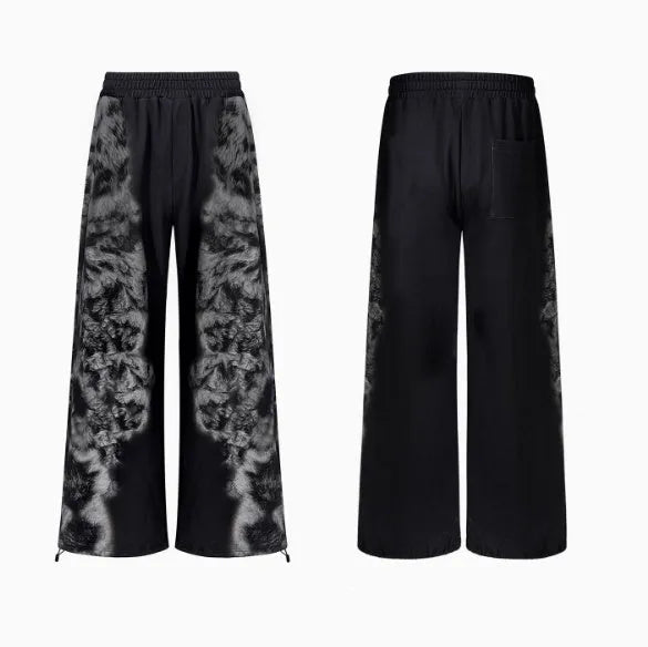 Unisex grey streetwear co-ord set featuring a printed hoodie, loose trousers, and seven-inch shorts laid flat