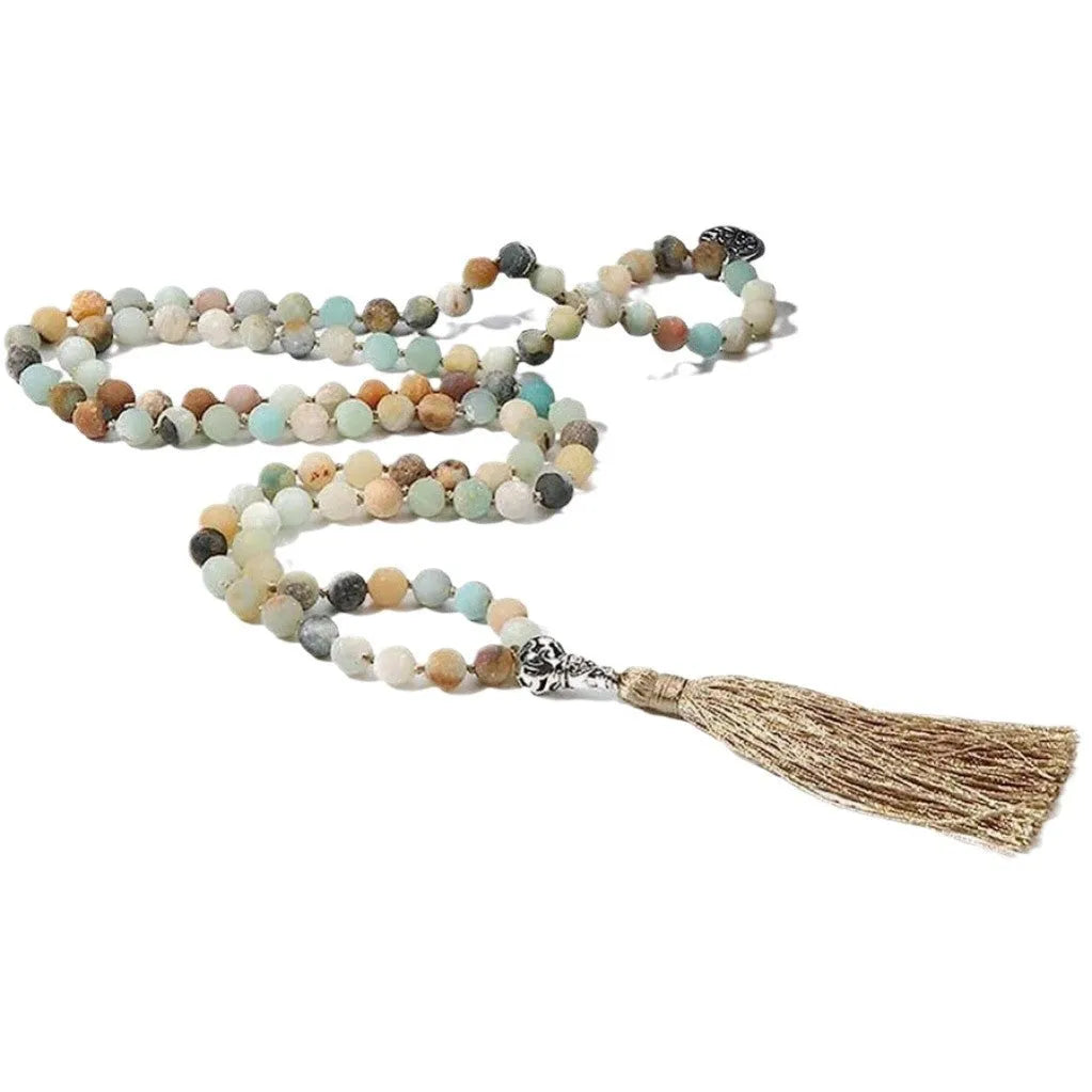 Handmade knotted stone bead necklace with 108 beads, showing geometric design and natural stone colours.