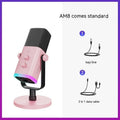 Black, pink, or white dynamic noise reduction microphone with XLR cable and base on a desk.