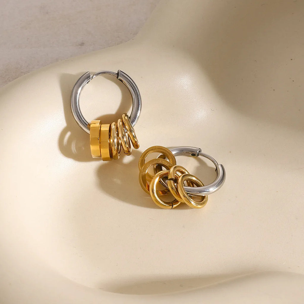 Pair of stainless steel ins style earrings with an electroplated silver-toned finish.