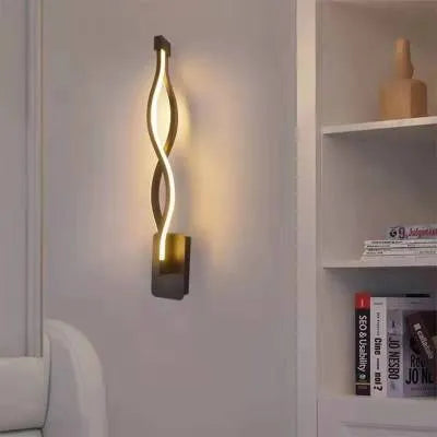 Nordic minimalist LED wall lamp with silicone shade in black finish on a white wall.