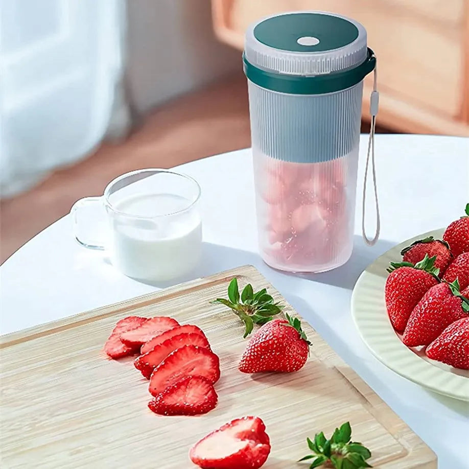 Blue portable blender cup with USB charging cable and stainless steel blending blades