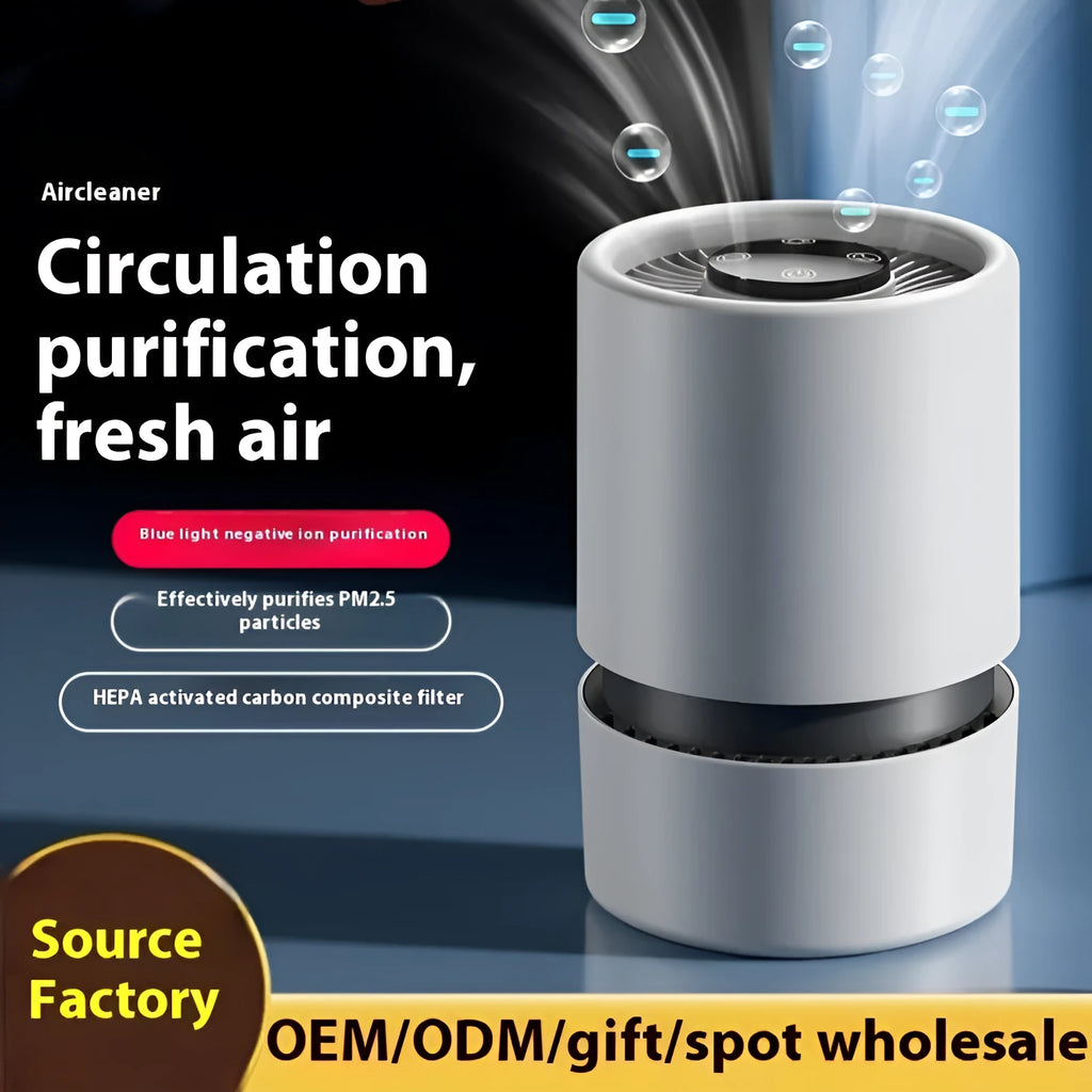 White desktop air purifier on a table with USB cable and aromatherapy tablets