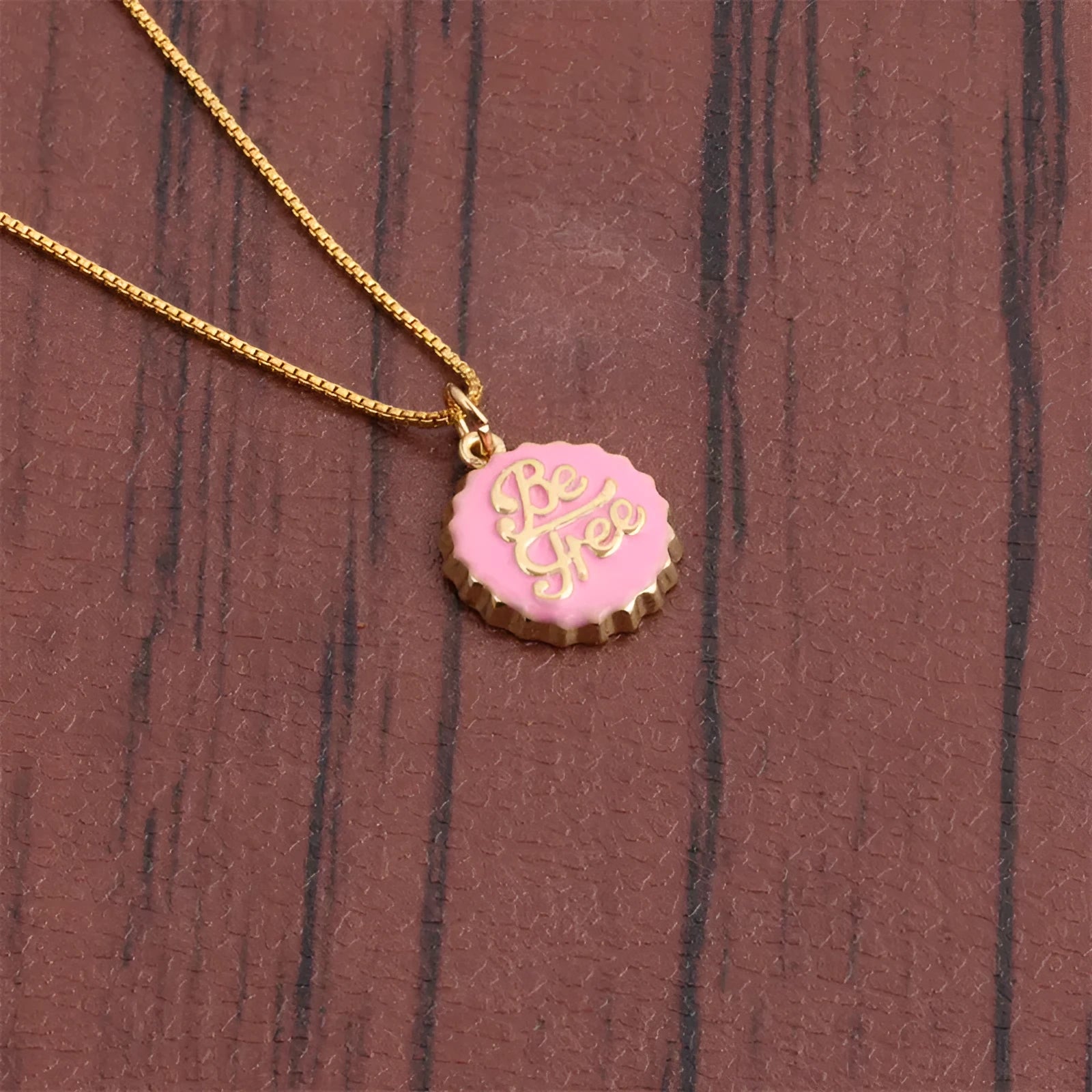 Copper bottle cap pendant necklace with 18K gold electroplating on a 40 cm box chain.