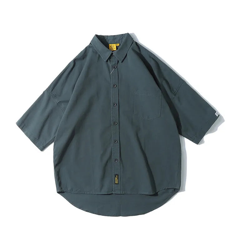 Man wearing a loose-fit Japanese style cotton cardigan shirt in a summer colour.