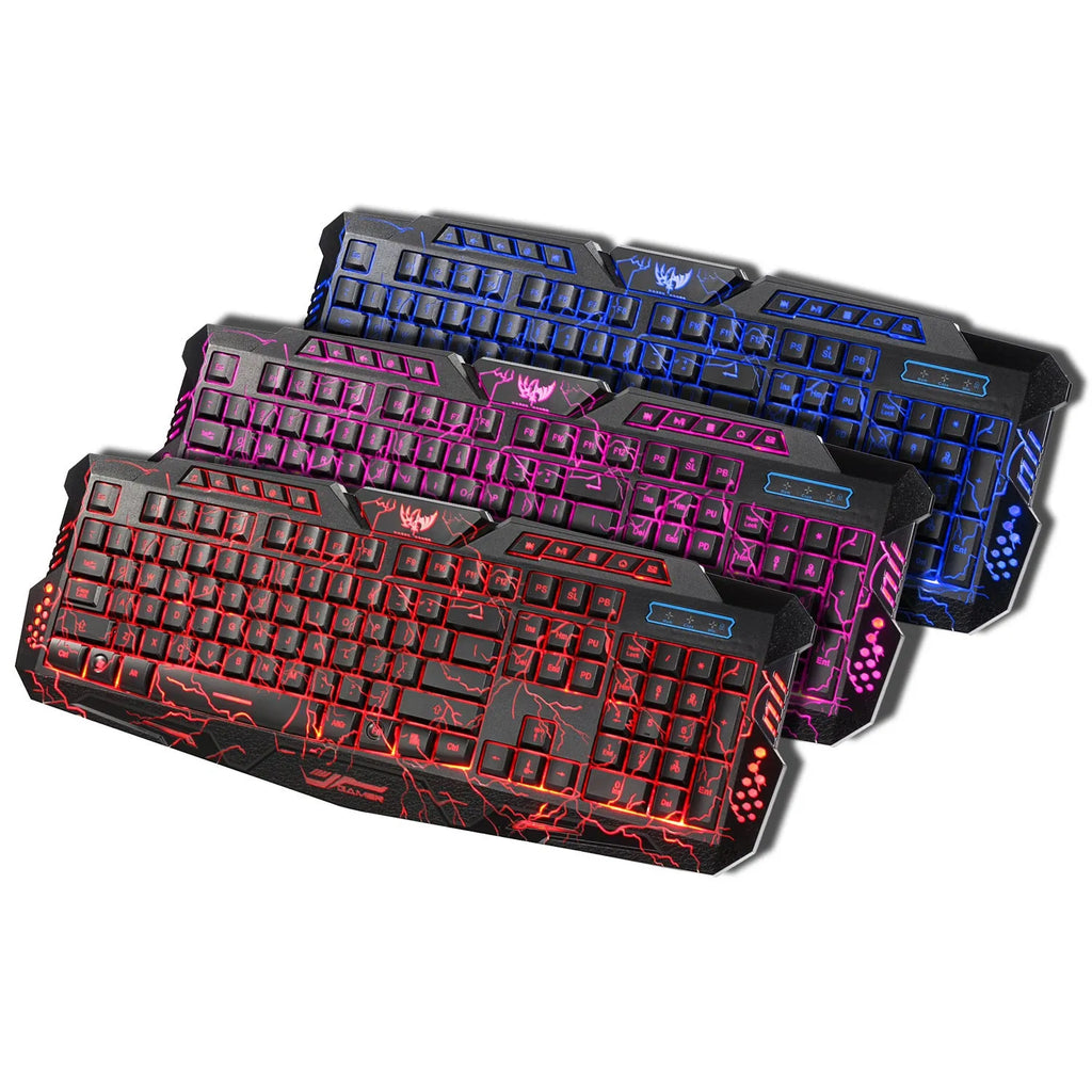 Black backlit game keyboard with crack design, 3-colour adjustable backlight, and anti-slip pads on a desk